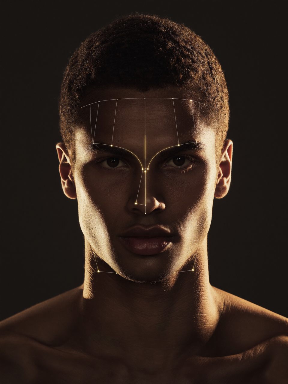 A face being analyzed by Faceo, with thin gold landmark lines mapped across the jaw, brow, and nose on a dark background.